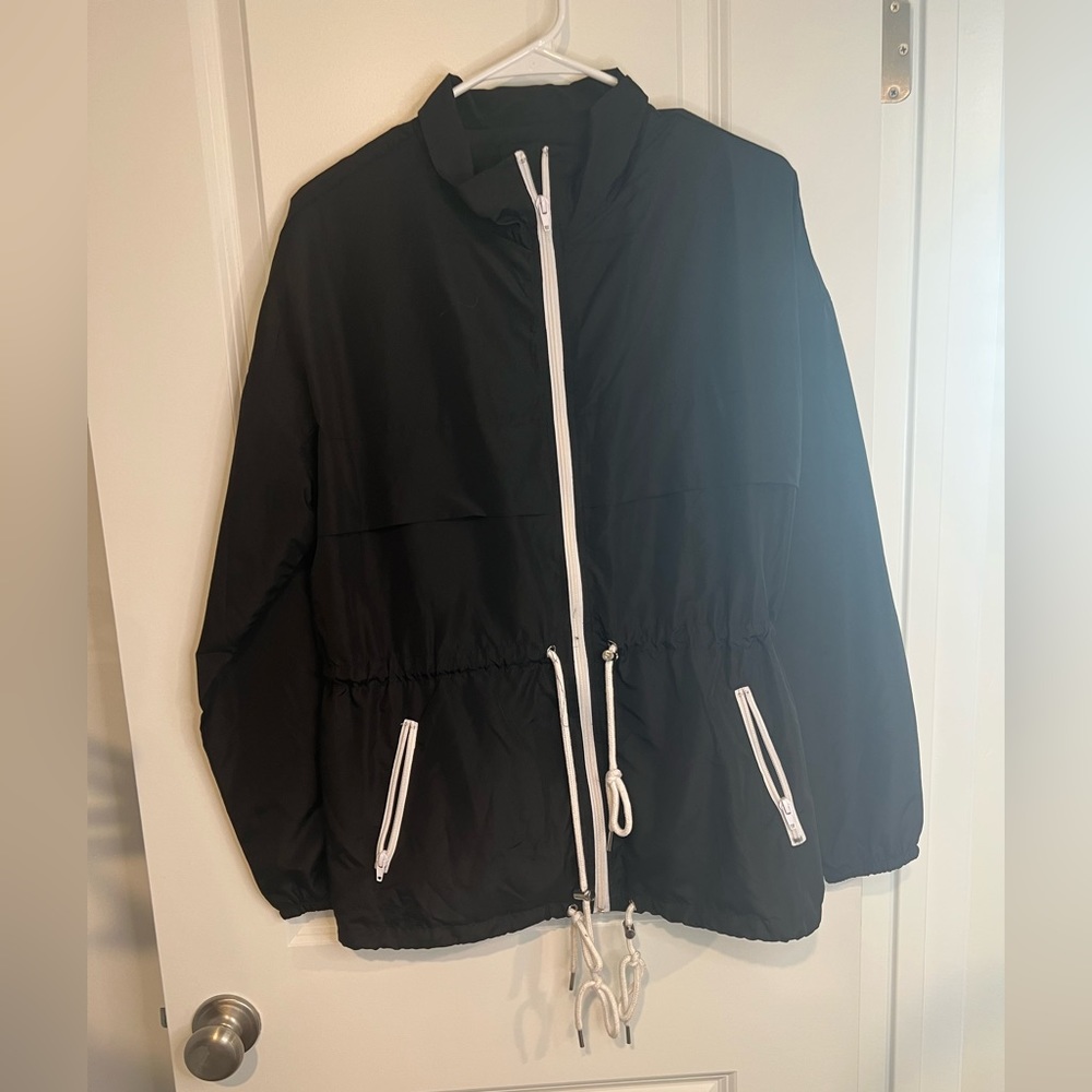 Medium full zip nylon wind breaker.